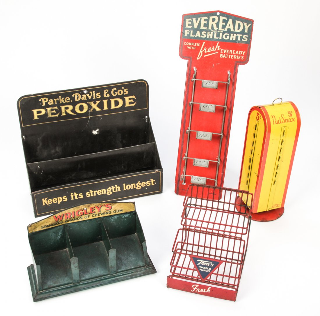 5 Lithographed Tin Counter Top Advertisements: Group of 5 Lithographed Tin Counter Top Advertisements. Consisting of a Wrigley's Gum tray, a Parke, Davis & Co. Peroxide tray, a Susu Nut Snax rotating stand, an Eveready Freash Batteries stand, and 
