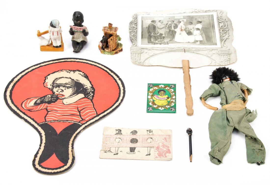 8 pc Black Memorabilia Lot: 8 pc Black Memorabilia Lot. Consisting of 3 porcelain figures of which 2 are marked Germany, a rag doll, a Cotton Belt Route pocket mirror, a pencil and 2 fans. Size: From 3" x 0.5" round (8 x 1 cm) t