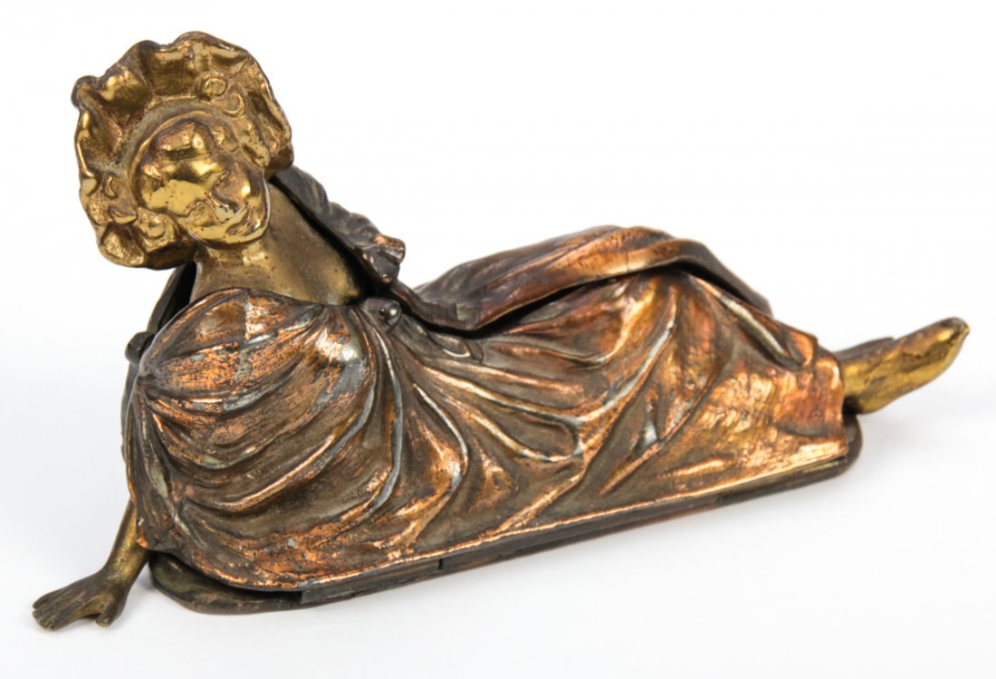 Jennings Brothers Naughty Bronze Lady JB 2039: Jennings Brothers Naughty Bronze Lady JB 2039 featuring a Victorian reclining woman that opens up to reveal a nude woman. One hinge detached. Size: 3" x 5.5" x 2" (8 x 14 x 5 cm)
