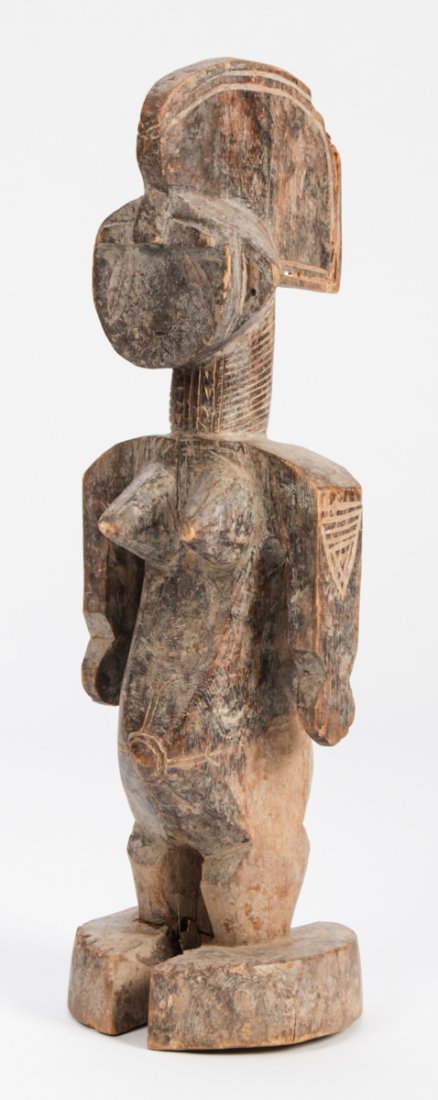 Nigerian Carved Figure: African Female Figure from the Iyale workshop, Dekina region, Nigeria, carved wood. African, mid 20th c. Size: 19"H (48 cm).