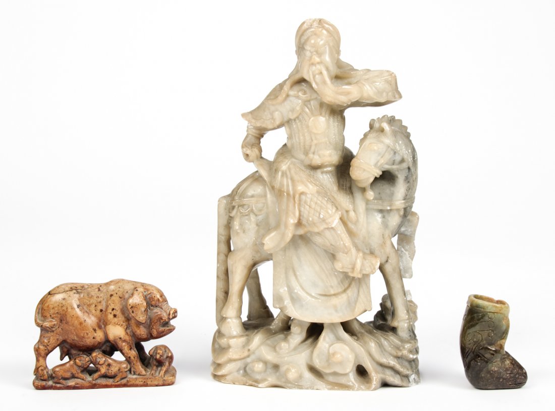 Suite of 3 Chinese Stone Artifacts: Suite of 3 Chinese Stone Artifacts. Consisting of a soapstone sow with piglets, a mounted Chinese warrior horseman and a deer form hardstone crucible. Ranging in size from 2.5" x 2" x 1" (6 x 5 x 3 cm