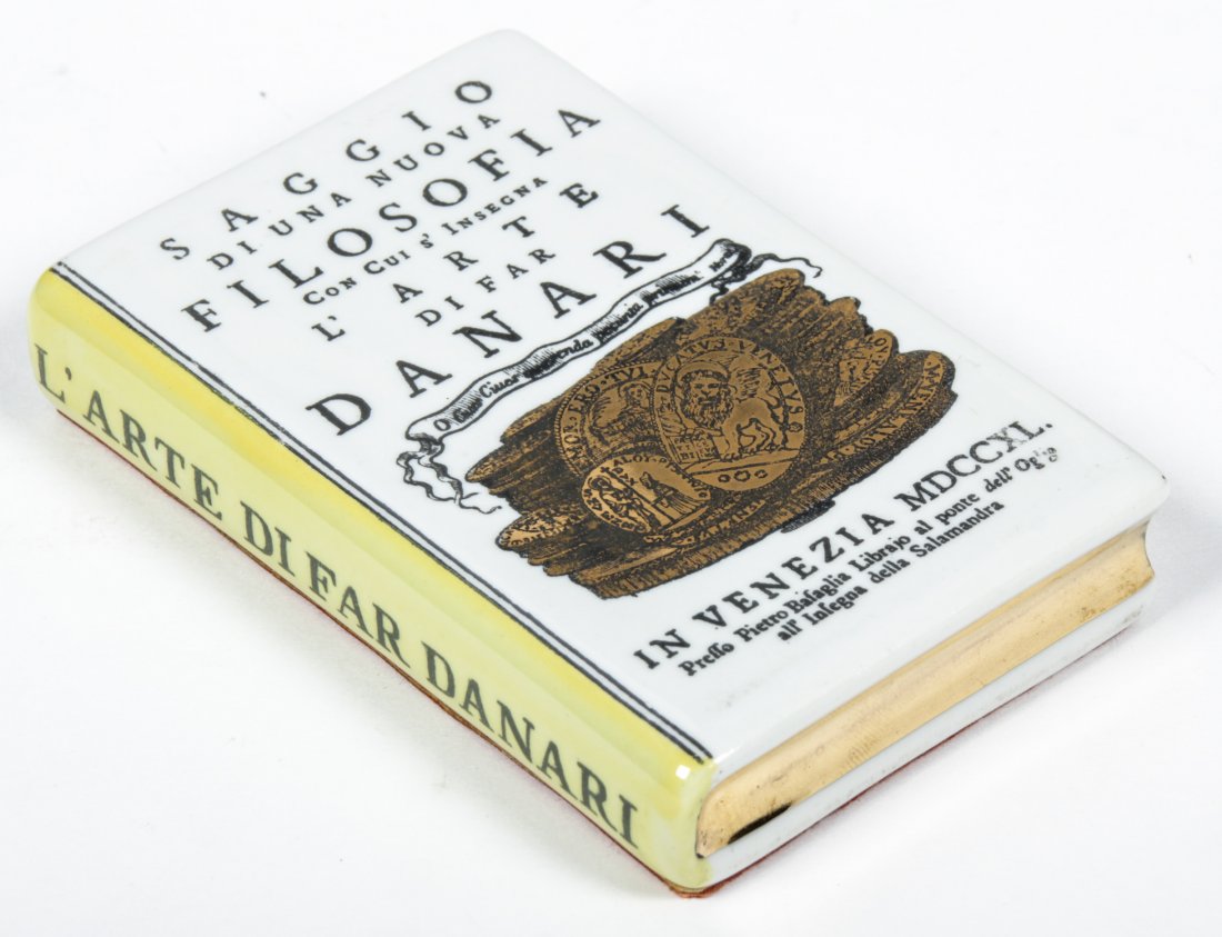 Fornasetti Trump L'oeil Porcelain Book-form Paperweight: Fornasetti Trump L'oeil Porcelain Book-form Paperweight. Size: 4.25" x 3" x .75" (11 x 8 x 2 cm).