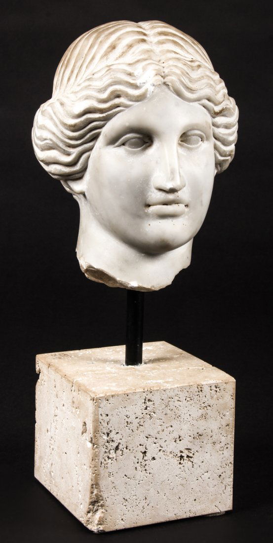 18th c. or older Carved Italian Marble Head: 18th c. or older Carved Italian Marble Head of the Roman Goddess Minerva on a travertine base. Head: 8"H x 6"W x 7.5"D (20 x 15 x 19 cm); overall: 15"H (38 cm).