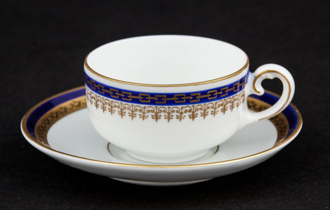 KPM Porcelain Cup and Saucer marked KPM Germany: KPM Porcelain Cup and Saucer marked KPM Germany. 2"H x 4.25"D (5 x 11 cm).