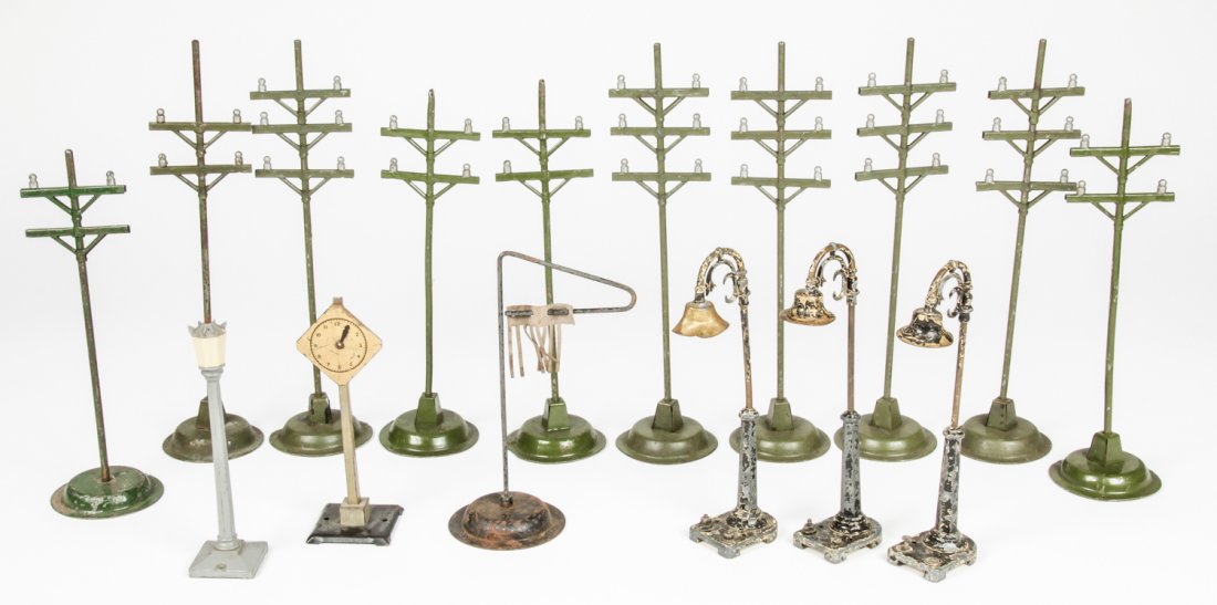 Collection of Vintage Scale Model Train Accessories: Collection of Vintage Scale Model Train Accessories. Consisting of telegraph poles, lamp posts and a clock tower. Size: Largest measures 11" x 3" x 3" (28 x 8 x 8 cm)