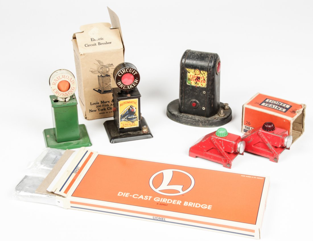 Collection of Vintage Scale Model Train Accessories: Collection of Vintage Scale Model Train Accessories. Consisting of circuit breakers, bumpers and a bridge from Lionel and American Flyer. Size: Largest measures 5" x 4.5" x 3.5" (13 x 12 x 9 cm)