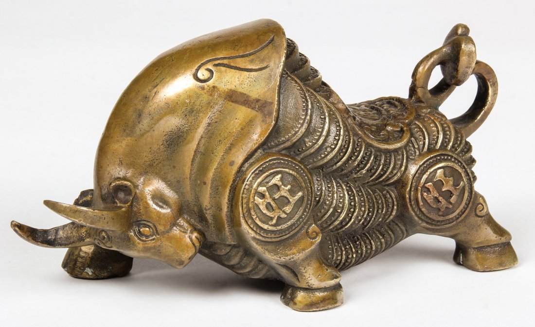 Chinese Bronze Bull: Chinese Bronze Bull, decorated with ancient coin and "Wang" marking. Size: 4" x 7.5" x 3.5" (10 x 19 x 9 cm).