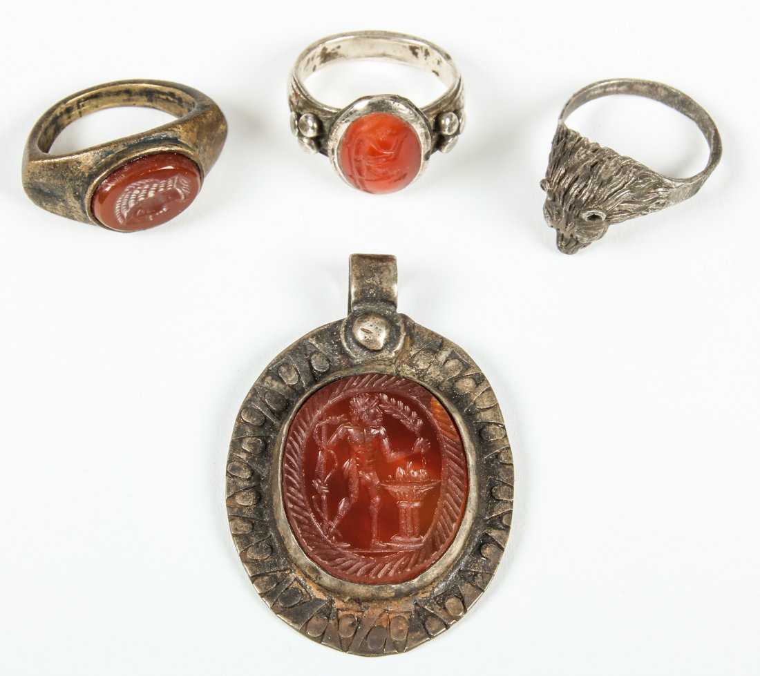 4 Ancient Jewelry Items, Carnelian Seal: 4 Ancient Jewelry Items including a Carnelian Seal. Size: Largest measures 2.25" x 1.5" x 0.5" (6 x 4 x 1 cm).