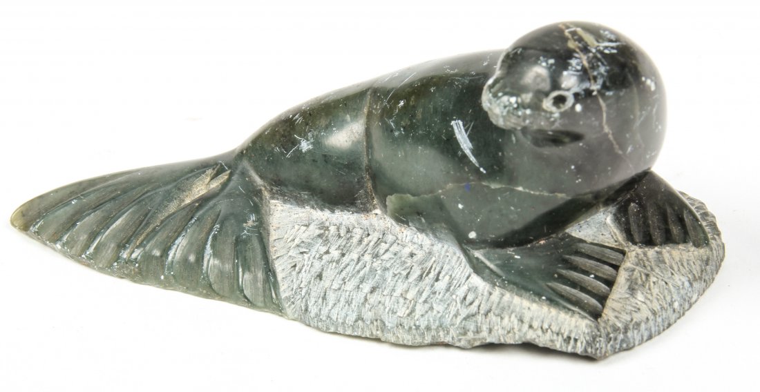 Carved Inuit Stone Seal: Carved Inuit Stone Seal, signed and dated 1977. Size: 2" x 3.75" x 2" (5 x 9.5 x 5 cm).