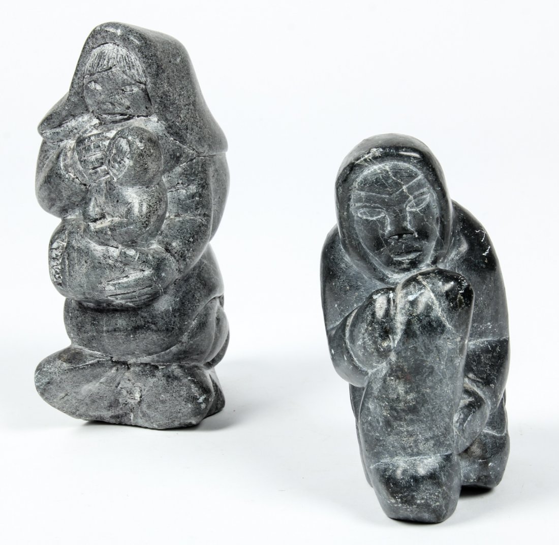 2 Inuit Carved Stone Figures: 2 Inuit Carved Stone Figures. Size: 5.25" x 2.75" x 4" (13 x 7 x 10 cm) and 6.75" x 2.75" x 4.5" (17 x 7 x 11 cm).