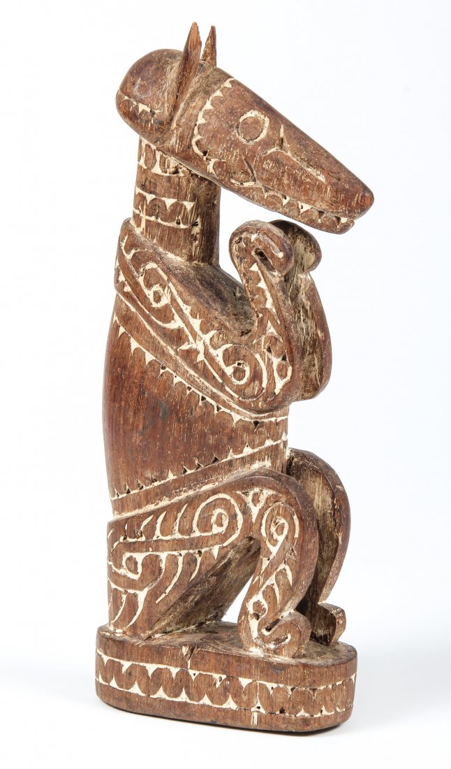 Maori Carving of a Dog: Maori Carving of a Dog. Size: 9" x 4" x 2" (23 x 10 x 5 cm).