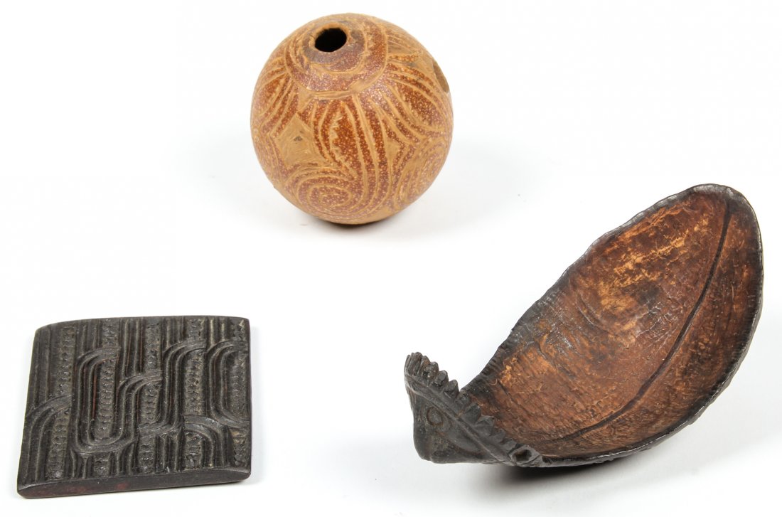 3 Toraja Artifacts: 3 Toraja Artifacts, carved wood. Indonesia. Ranging in size from 3" x 2.75" x .25" (7.5" x 7 x .5 cm) to 5.25" x 3" x 2" (13 x 7.5 x 5 cm).