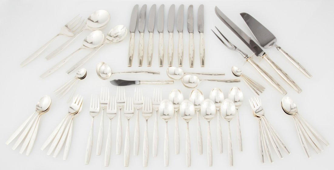 Raymond Loewy for Wallace Discovery Pattern Silver: Wallace Sterling Silver Flatware Service in the "Discovery" Pattern by Raymond Loewy in 1957. Set includes: 8 Dinner Knives, 8 Dinner Forks, 8 Soup Spoons, 8 Salad Forks, 8 Teaspoons, 8 Demitasse Spoo