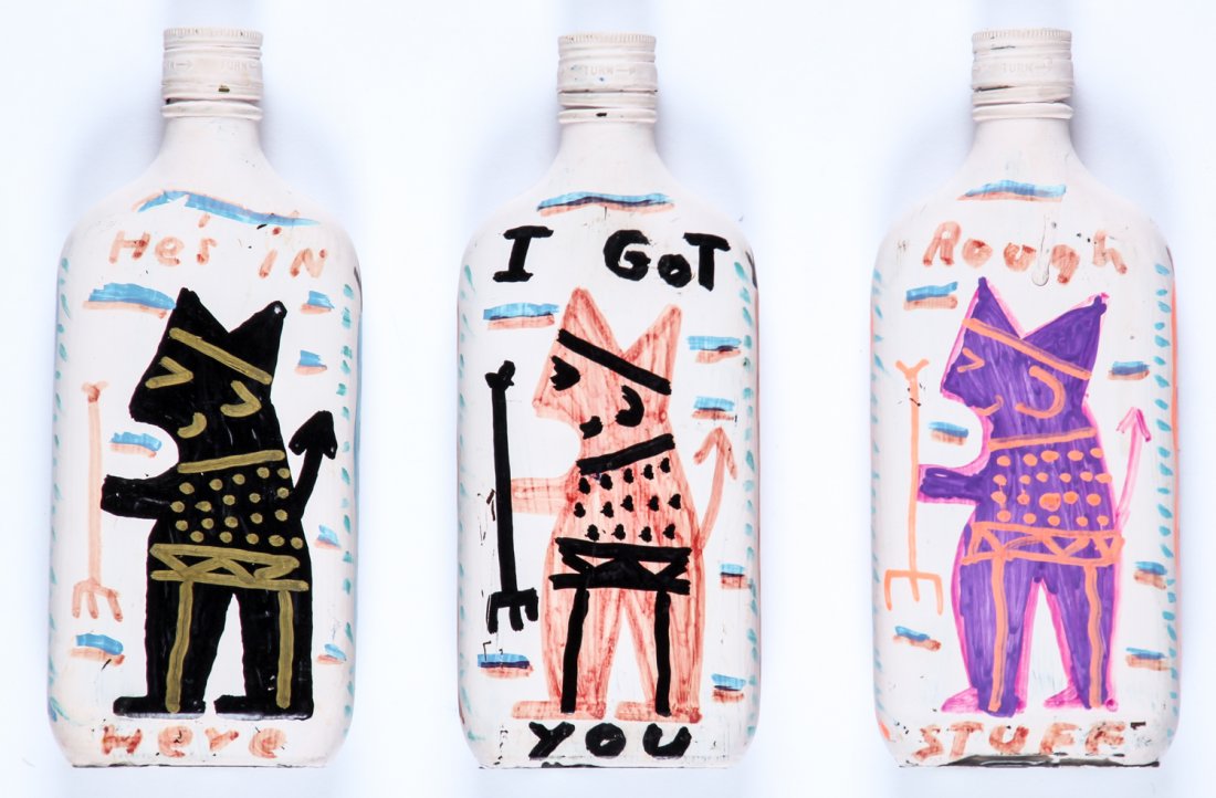 R.A. Miller (USA, 1912-2006) 3 Painted Bottles: R.A. Miller (USA, 1912-2006) 3 Painted Glass Bottles: 1) He's in Here, Yep in Here; 2) I got you, you no it to; 3) Fire Water, Rough Stuff; each paint on glass bottle. Size: 9" x 4" x 1.5", 23 x 10 x 