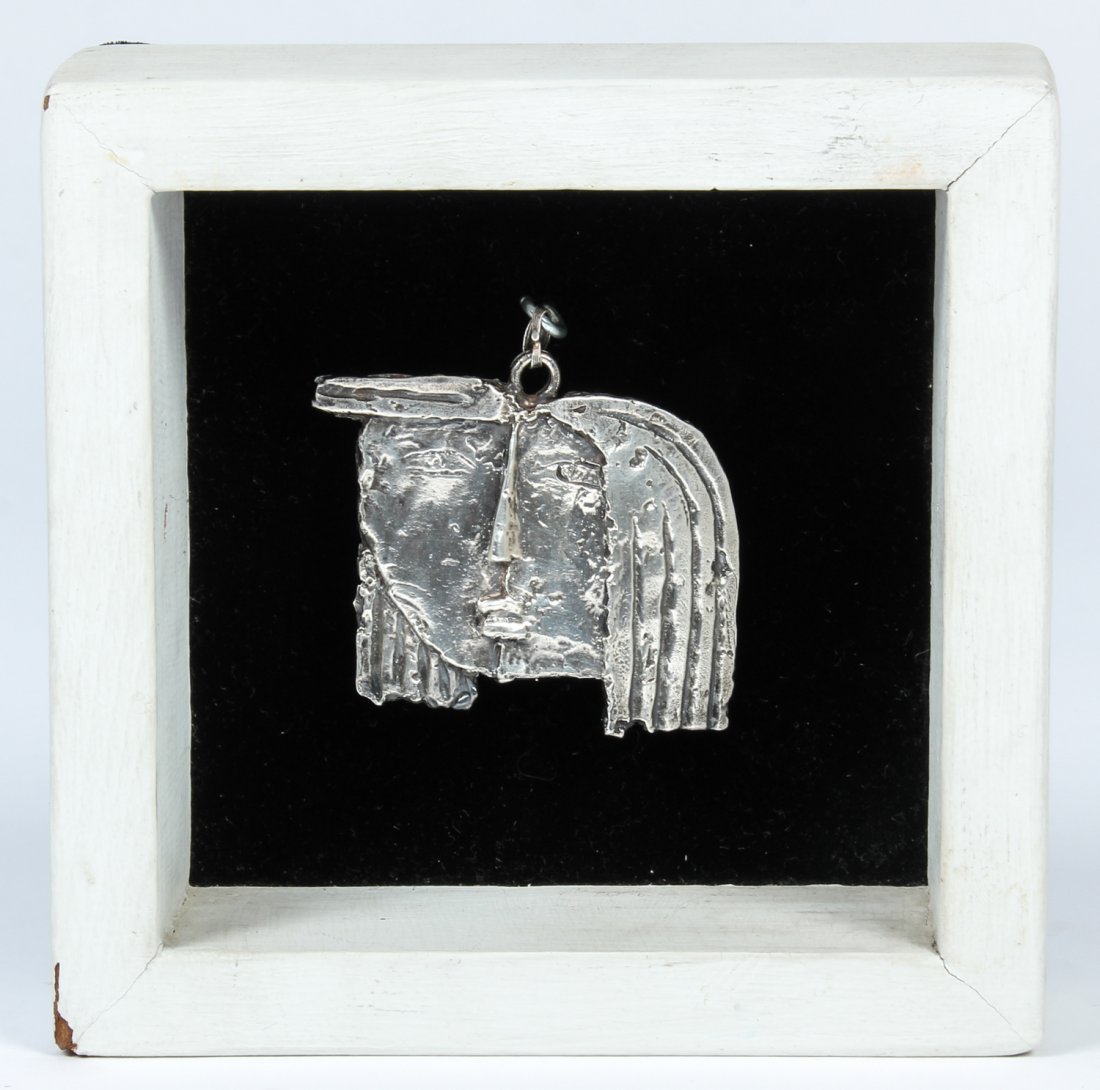 Angel Botello (1913-1986) Sterling Silver Girl Pendant: Angel Botello (1913-1986) Sterling Silver Girl Pendant. In custom open shadow box. Signed. Size: 2.5" x 2.75" x .25", 6 x 7 x .5 (pendant); 6.25" x 6.25" x 2", 16 x 16 x 5 cm (box).