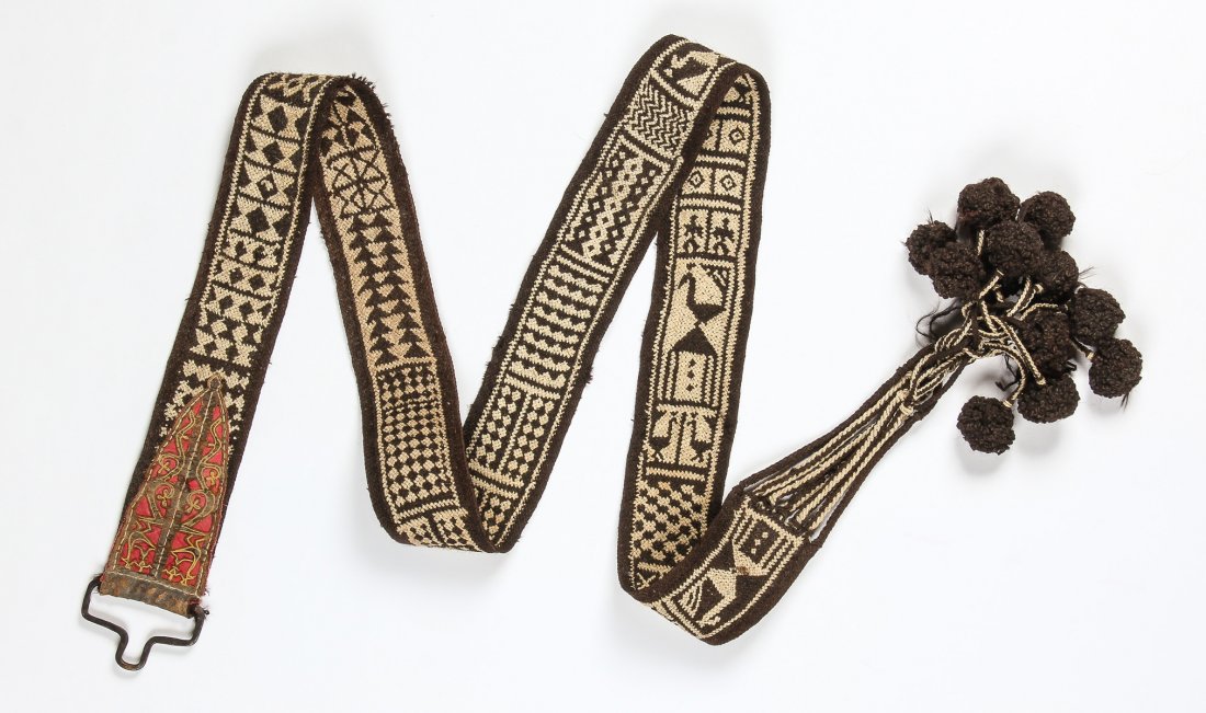Old Middle Eastern Camel-Cinching Belt: 116" x 4" (295: Old Middle Eastern Camel-Cinching Belt: 116" x 4" (295 x 10 cm). Woven shades of natural wool with tassels at bottom. Estate of W. Norton Grubb.