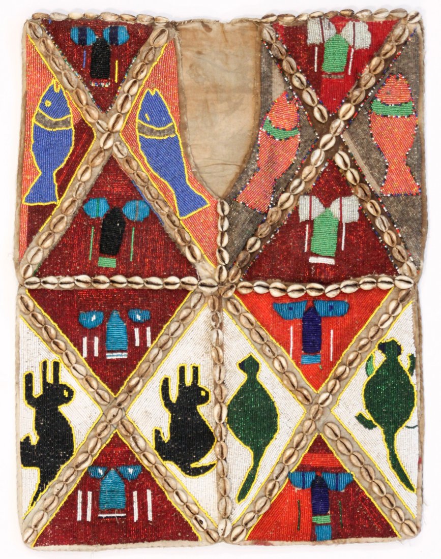 Old Yoruba Multi-Colored Beaded Vestment, Nigeria: Old Yoruba Multi-Colored Beaded Vestment, Nigeria. Shows use but in excellent condition, glass beads, cowrie shells. Size: 18.5" x 25" (47 x 64 cm). Provenance: Private Savannah, Georgia collection.