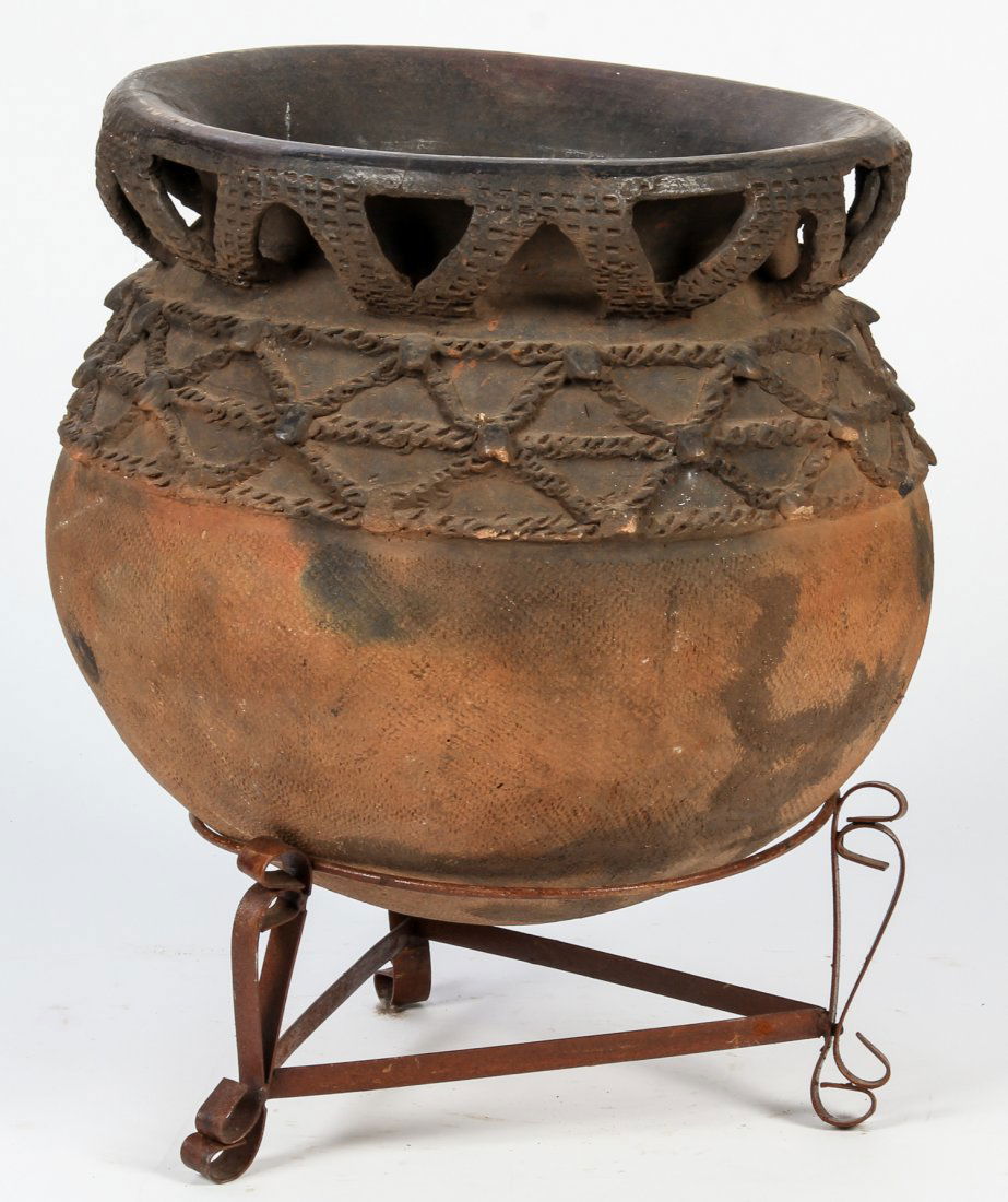 West African Earthenware Pot on Stand: West African Earthenware Pot on Stand. Size: 14" x 17" x 17" (36 x 43 x 43 cm). Provenance: Private Savannah, Georgia collection.