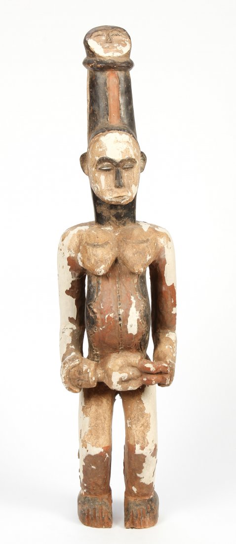 Large Ibo Figure, Nigeria: Ibo Figure, Nigeria, carved wood, pigment. Size: 38" x 9" x 7" (97 x 23 x 18 cm).