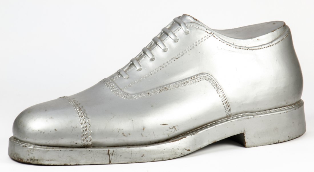 Oversized Dress Shoe Store Display: Oversized Dress Shoe Store Display. Silver painted wood. Size: 12" x 29" x 10" (30 x 74 x 25 cm).