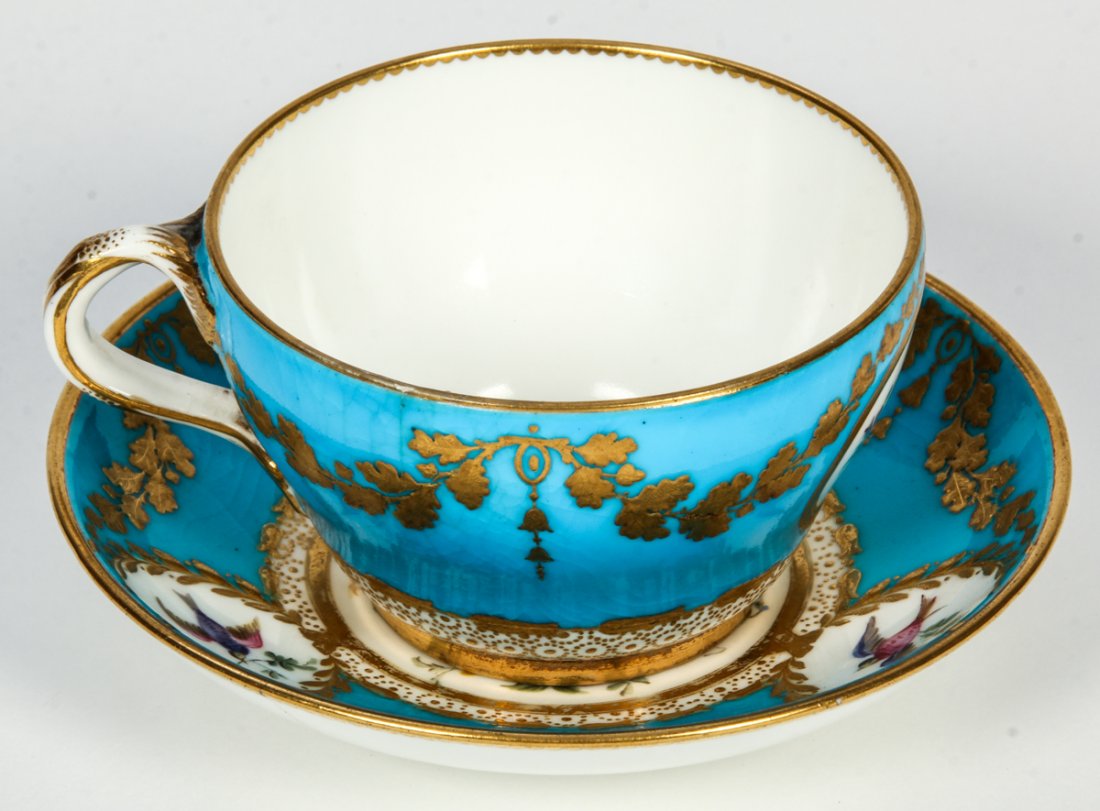 Minton for Tiffany Hand Painted Cup & Saucer: Minton for Tiffany & Co. New York Hand painted Enameled Floral Bone China Cup and Saucer. Size: 2" x 4" x 3.25", 5 x 10 x 8 cm (cup); 4.75"D, 12 cm (saucer).