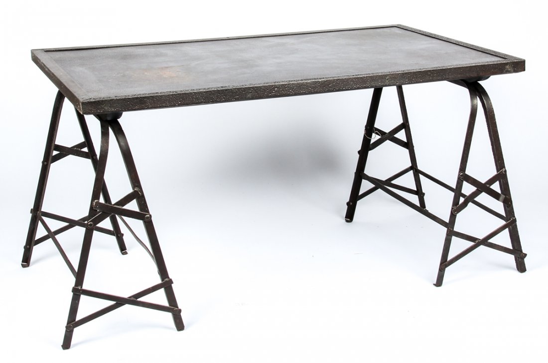 Industrial Style Trestle Table: Industrial Style Trestle Table. Heavy bonded steel plate top with riveted apron over iron trestle legs. Size: 30" x 56.5" x 35.5" (76 x 144 x 90 cm). Prov: Estate of Sharon Simonaire, NYC.