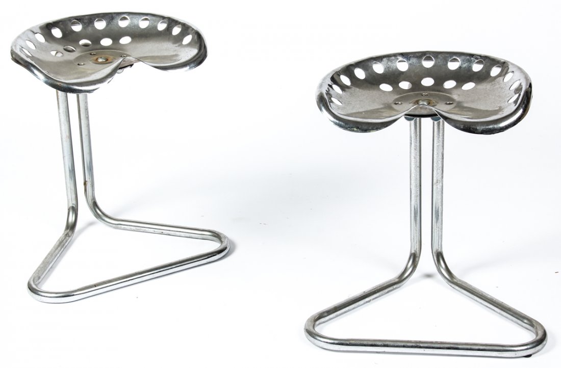 Pair of Chrome Tractor Seat Stools: Pair of Chrome Tractor Seat Stools. In the modern style of Prouve and Castiglioni, formed seats over cantilevered tubular frames. Size: 22" x 19.5" x 14.5", 56 x 50 x 37 cm (each).