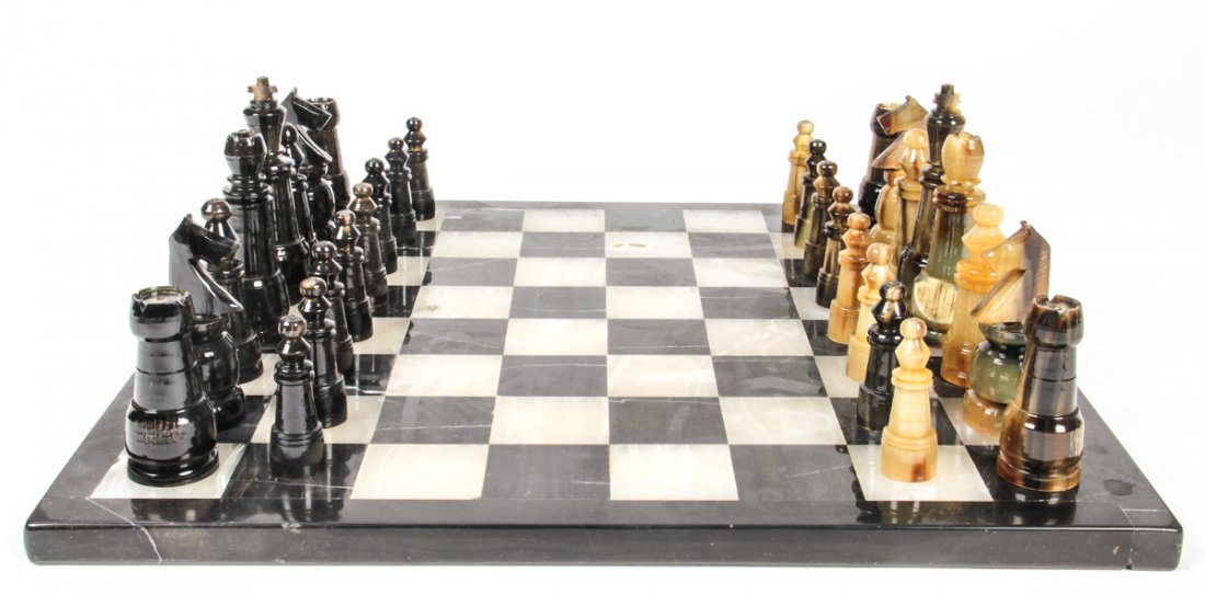 Horn Chess Set Atop Alabaster Gameboard: Complete Chess Set Carved and Turned Horn (includes box) Atop Alabaster Chess board.