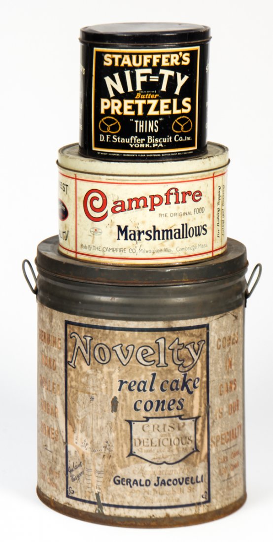 Collection of 3 Vintage General Store Advertising Tins: Collection of 3 Vintage General Store Advertising Tins. Consisting of tins for Stauffer's Nifty Pretzels, Campfire marshmallows, and Novelty Cake Cones. Size: 14.75" x 14" x 12.25", 37 x 36 x 31 cm (l