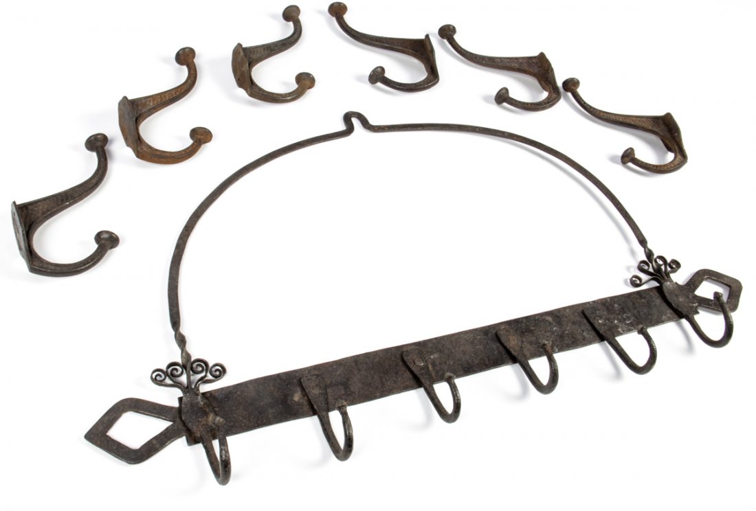 Antique Hooks Collection: Antique Hooks Collection. Consisting of 6 cast coat hooks and a rustic wrought iron kitchen hearth hook rack. Size: 6" x 1.5" x 4" (15 x 4 x 10 cm) and 14.5" x 25" x 2" (37 x 64 x 5 cm).