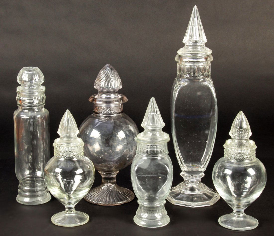 Group of 6 Antique Glass Candy Jars: Group of 6 Antique Apothecary General Store Glass Lidded Candy Jars. Ranging in size from 9" x 4" (23 x 10 cm) to 16" x 4.5" (41 x 11 cm).