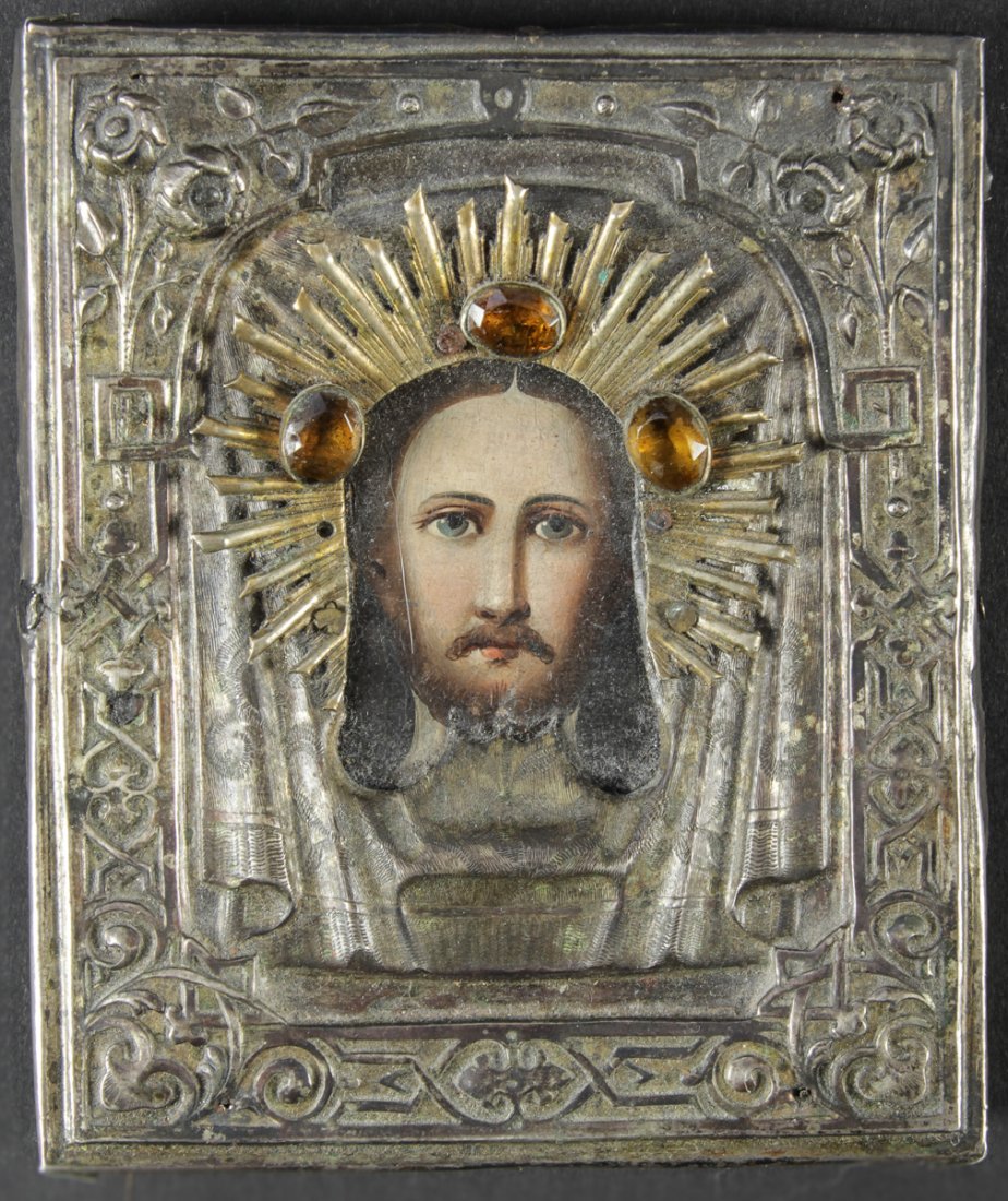 Antique Russian Icon with Silver Oklad: Antique 19th c. Russian Orthodox Icon, depicting Jesus Christ, hand painted egg tempera and gesso on wood panel, with Russian 84 silver, hallmarked oklad. Size: 4.25" x 3.5" (11 x 9 cm).