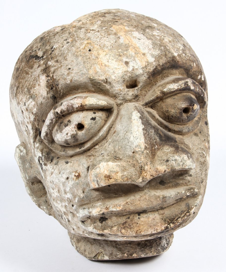 500 year old Yoruba Stone Head: Yoruba African Carved Stone Head, 500 years old. Provenance: acquired at Hemingway African Art, Manhattan Art & Antique Center, New York City. Size: 10" x 8" x 10.5" (25 x 20 x 27 cm).