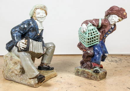 Pair Architectural Italian Glazed Terracotta Figures: Pair Architectural Italian Glazed Terracotta Figures. Large scale figures of a sailor boy with an accordion seated on a crag and a boy in a tri-corner hat carrying a birdcage and closely followed by