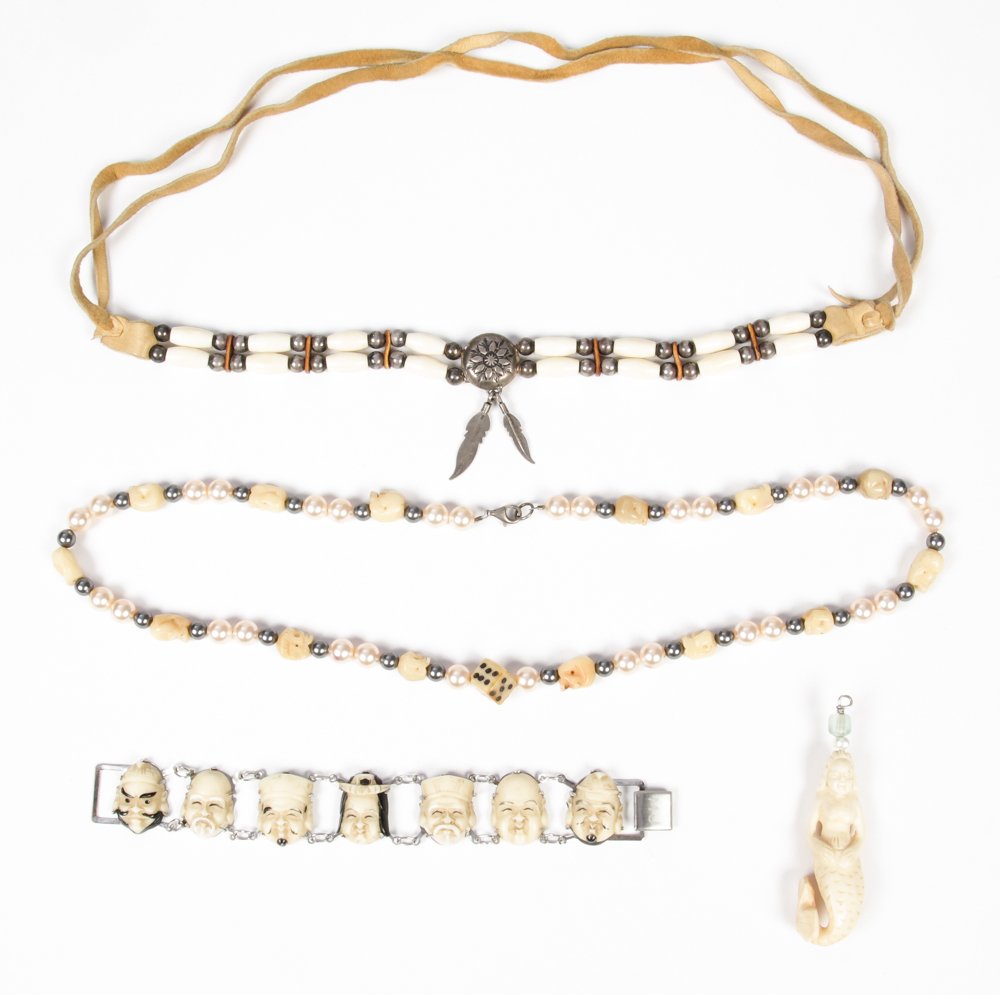 Estate Lot of Bone Theme Jewelry: Estate Lot of Bone Theme Jewelry. Including a carved mermaid charm, a native American bone and silver strand, a Marc Jacobs Netsuke bracelet, and a skull bead necklace. Size: Ranging from 3" x 0.75" x