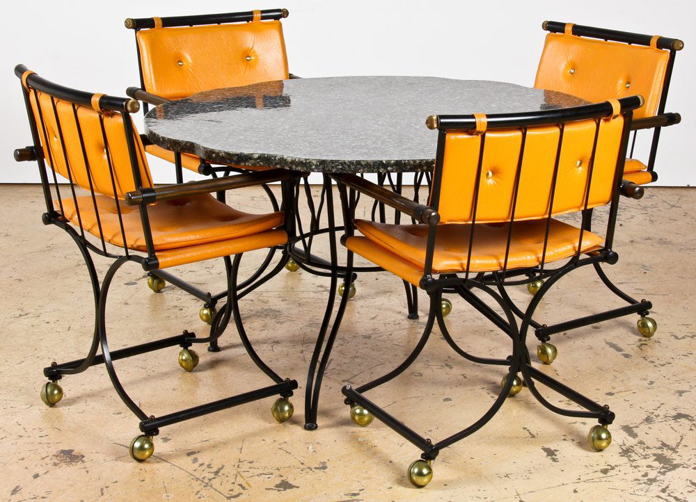Vintage Custom Kitchen Dinette Set: Vintage Custom Kitchen Dinette Set. Composite shell table over wrought iron base and four Wrought iron chairs on stylized castered bases. Size: 35" x 22" x 20.5", 89 x 56 x 52 cm (each chair) and 29"