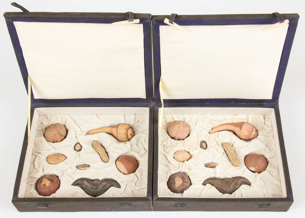 2 Boxed Sets of Chinese Yixing Zisha Carved Earthenware: 2 Boxed Sets of Chinese Yixing Zisha Carved Earthenware Nuts. Size: Largest item measures 3" x 1.25" x 1.25" (8 x 3 x 3 cm).