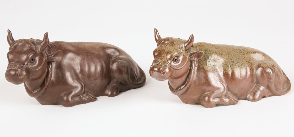2 Antique Japanese Earthenware Recumbent Oxen: 2 Japanese Earthenware Recumbent Oxen. Size: 5" x 12" x 5", 13 x 30 x 13 cm (each).
