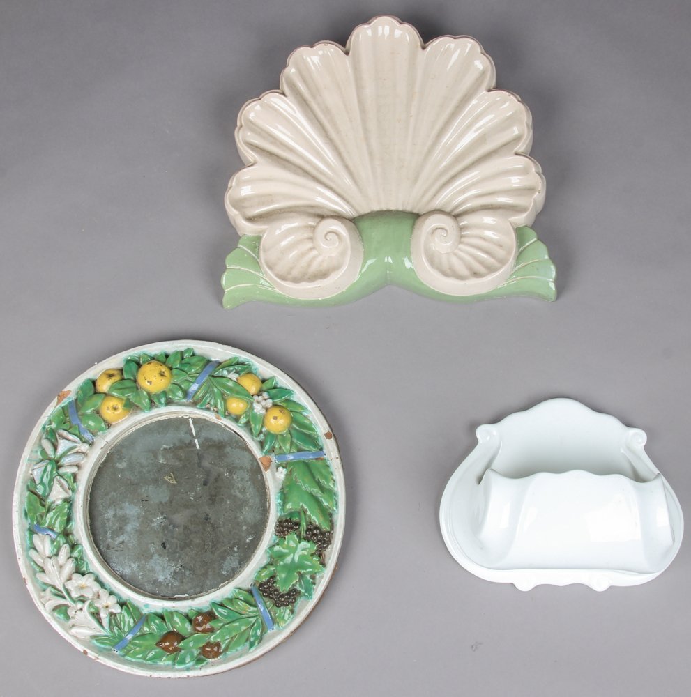 3 Pc Glazed Ceramic Wall Decor Group: 3 Pc Glazed Ceramic Wall Decor Group. Consisting of an antique Majolica porthole mirror, a Kay Finch California Shell Form wall pocket, and a continental lavabo basin. Size: 16" x 14" x 2.75", 41 x 36