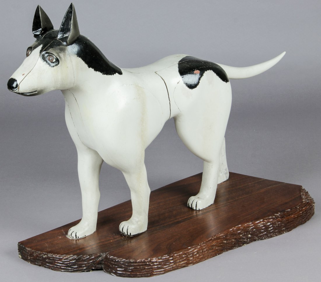 John J. Stanko (American, 1925-2014) Sculpture: John J. Stanko (American, 1925-2014) Sculpture, Dog, carved wood, paint, areas of cracking. Size: 23.25" x 30" x 11.5" (59 x 76 x 29 cm). Provenance: estate of the artist. The sale debuts the work of 