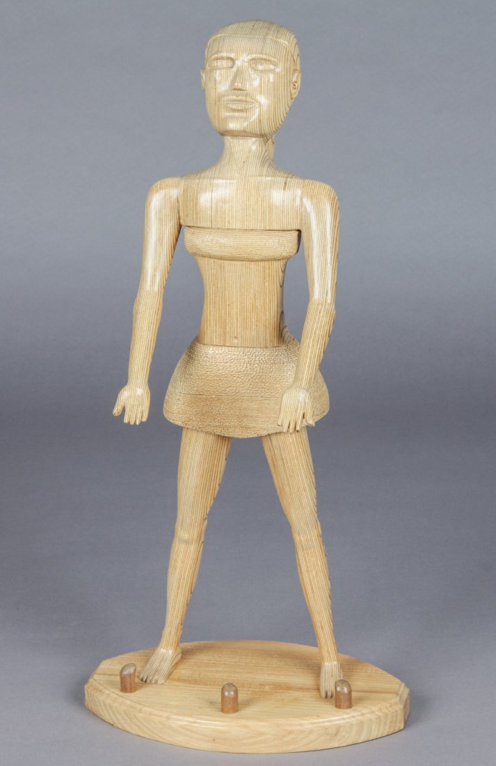 John J. Stanko (American, 1925-2014) Sculpture: John J. Stanko (American, 1925-2014) Sculpture, Standing Girl with Ponytail, carved wood. Size: 26" x 12" x 8.5" (66 x 30 x 22 cm). Provenance: estate of the artist. The sale debuts the work of a newl
