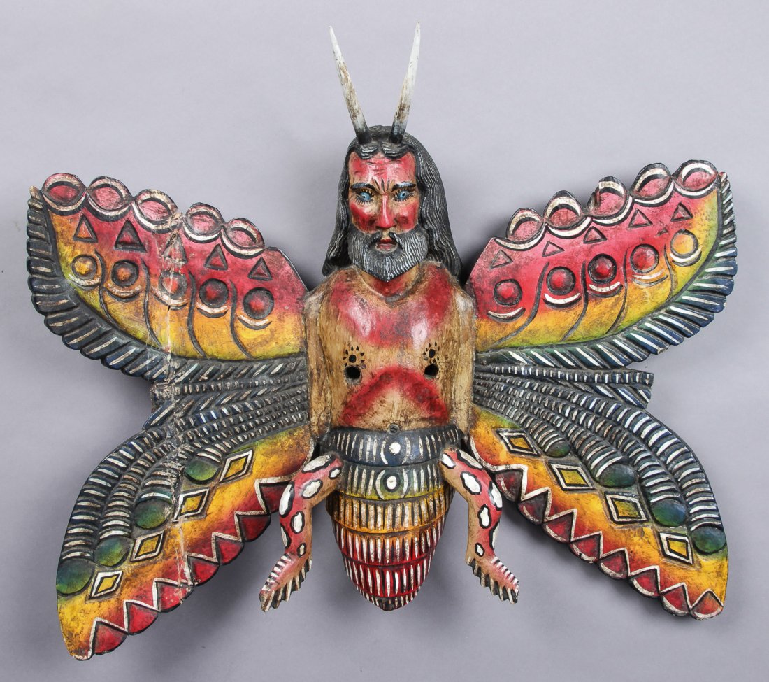Mexican Butterfly Mask: Mexican Male butterfly mask for the Dance of the Moors and Christians. carved and painted wood. Size: 24" x 27" x 7" (61 x 69 x 18 cm). Prov: Richard and Jean Kellaway; Danforth Museum, Framingham, Ma