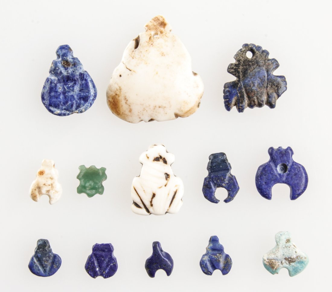 13 Ancient Stone and Faience Frog and Shell Forms: 13 Ancient Stone and Faience Frog and Shell Forms. Largest measures: 1.25"L (3.5 cm). Provenance: Piero and Paola Ferro.