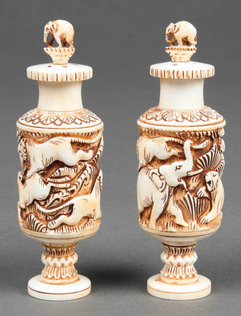 Pair of Semi-Antique Carved Ivory Containers: Pair of Semi-Antique Carved Ivory Containers - a pair of salt and pepper containers, each with a nicely carved jungle scene. Manufactured originally in Gujarat or Rajasthan, early 20th century -Africa