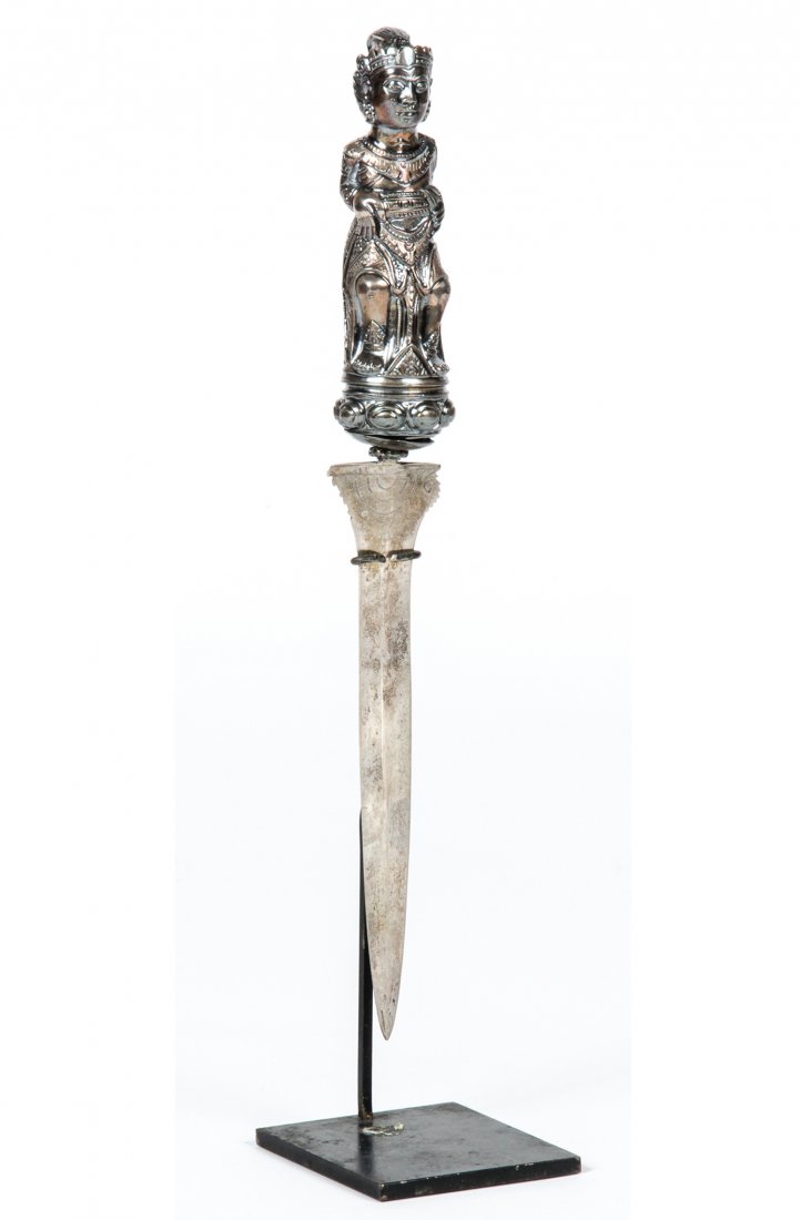 An Indonesian Silver Kris and Handle, 19th C.: An Indonesian Silver Kris and Handle, 19th C. Size: 11" x 1.5" x 1.25", 28 x 4 x 3 cm (without stand). Provenance: Estate of Robert Swan Lindsley and Eric Hoage, Philadelphia.