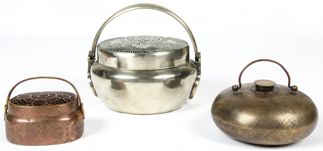 3 Antique Chinese Metal Warmers: 3 Antique Chinese Metal Warmers: A large Chinese paktong handwarmer with fu bats on latticed lid 19th century D: 9 1/2 in., 24cm; A small Chinese copper handwarmer 19th century; A circular Chinese bro