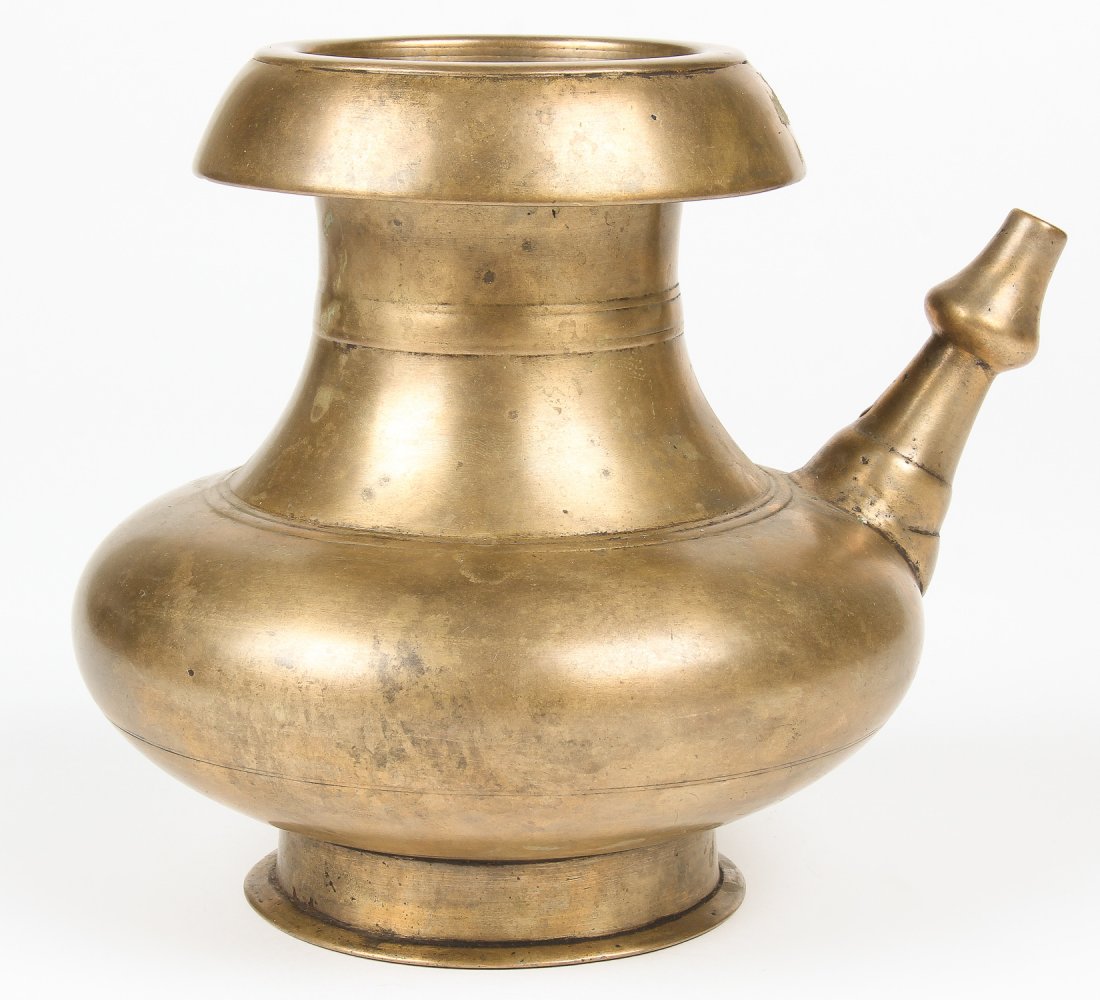 19th C. Bronze Karuwa: 19th C. Bronze Karuwa, Nepal, heavy, pinched form, clean and simple lines. Size: 7" x 6.5" x 7.75" (18 x 17 x 20 cm). Weight: 1895 grams. Provenance: Matthew Friedman Collection. Matthew Friedman is a