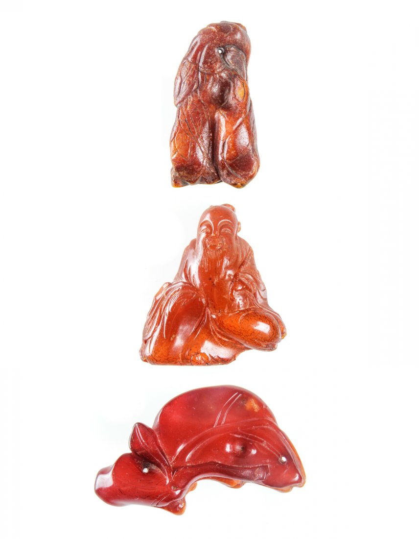 3 Antique Chinese Amber Amulets: 3 Antique Chinese Amber Amulets, Ming/Qing Dynasty. Sizes (top to bottom): 1) 2.25" x 1.25" (5.75 x 3 cm); 2) 1.75" x 1.5" (4.5 x 3.75 cm); 3) 1.25" x 2" (3 x 5 cm). Provenance: Piero and Paola Ferro.