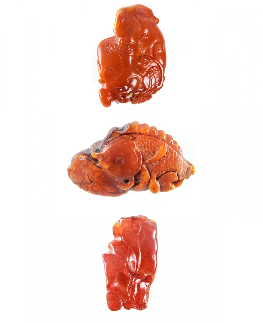 3 Antique Chinese Amber Amulets: 3 Antique Chinese Amber Amulets, Ming/Qing Dynasty. Sizes (top to bottom): 1) 1.25" x 2" (3 x 5 cm); 2) 1.25" x 2.25" (3 x 5.75 cm); 3) 2.25" x 1.25" (5.75 x 3 cm). Provenance: Piero and Paola Ferro.