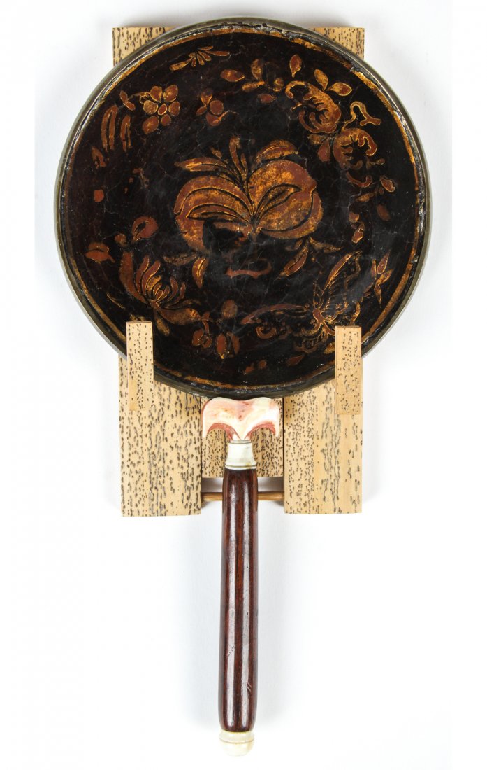A Chinese Lacquered Silver Mirror, Ming Dynasty: A Chinese Lacquered Silver Mirror, Ming Dynasty, with wooden handle. Size: 8" x 4.25" x .5" (20 x 11 x 1 cm). Provenance: Estate of Robert Swan Lindsley and Eric Hoage, Philadelphia.